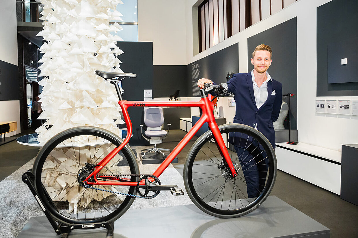 Sebastian Meinecke with his product in the Red Dot Design Museum Essen